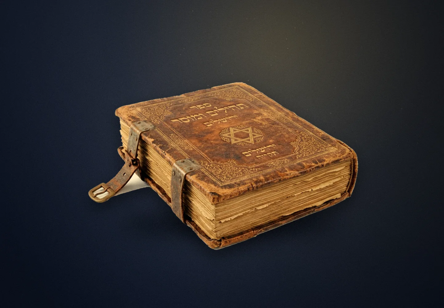 An antique leather-bound Hebrew book with a gilt Star of David and clasp